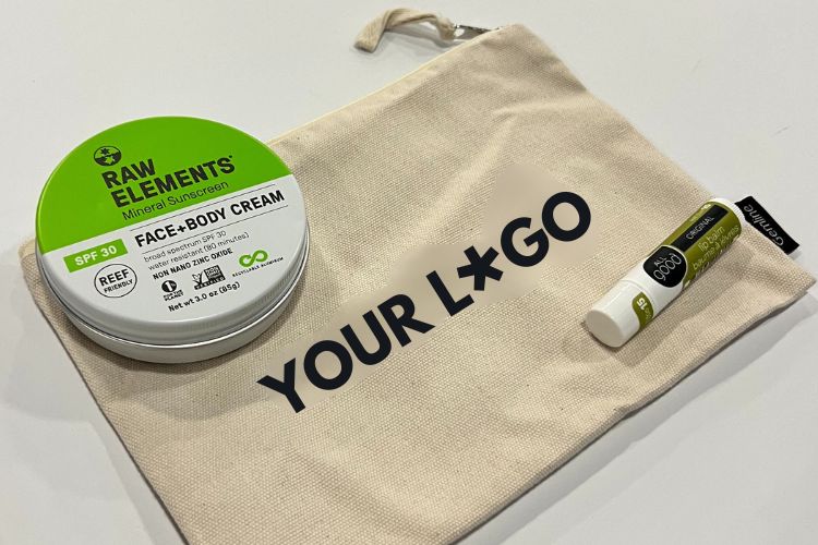 Eco-friendly conference and event gift set with organic cotton bag, reef-safe sunscreen and natural lip balm
