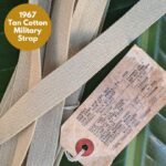 Tan 1960s strap with origin tag for upcycled rental conference lanyards