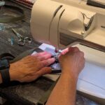 Salvaged military webbing rental lanyards getting sewn in the USA