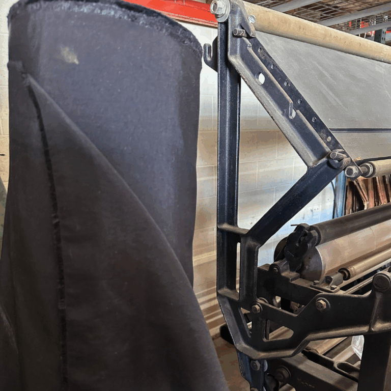 Salvaged 1990s military fabric roll for upcycled sustainable rental lanyards