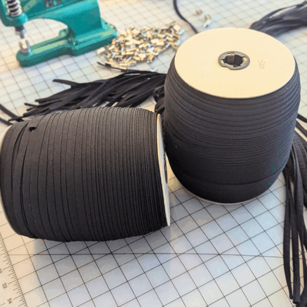 Rolls of salvaged fabric cords for eco-friendly conference and event rental lanyards