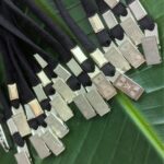 Sustainable rental lanyards made in the USA from salvaged black military fabric