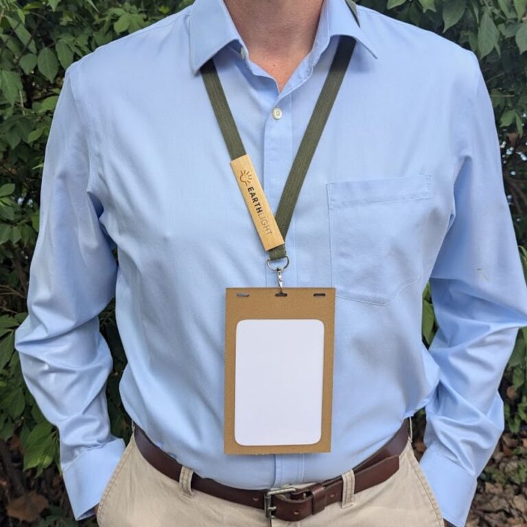 Man wearing single-hook lanyard made from recycled, repurposed material with plastic-free badge holder made in USA