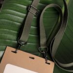 Close up of adjustable, double-hook lanyard with gunmetal hardware made in USA from salvaged military webbing