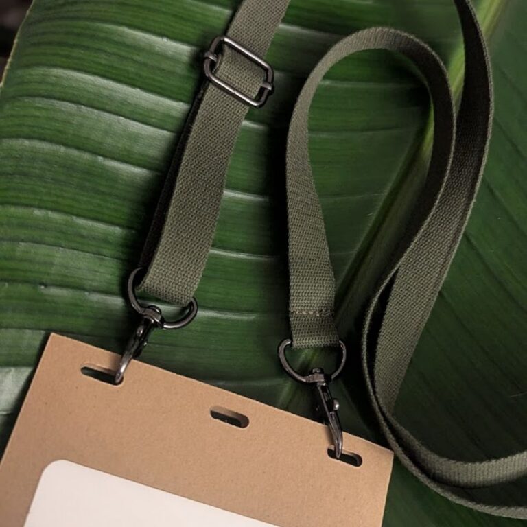 Close up of adjustable, double-hook lanyard with gunmetal hardware made in USA from salvaged military webbing