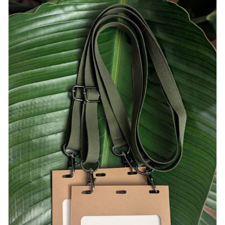 Two plastic-free name badge holders and adjustable, double-hook salvaged materials lanyards for purchase or rent