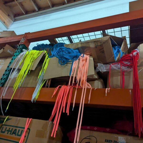 Salvaged waste strings for upcycled eco-friendly lanyards