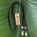 Black lanyard with double bulldog clips made from upcycled military fabric in USA with wood return tag