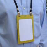 Eco friendly event name badge holder made from 50% grass paper with recycled fabric lanyard made in USA