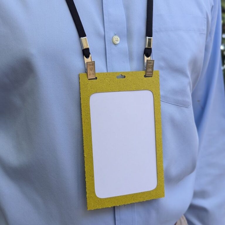 Eco friendly event name badge holder made from 50% grass paper with recycled fabric lanyard made in USA