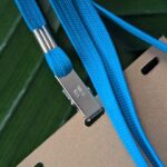 Close up of single bulldog hook lanyard made from upcycled sustainable scrap strings