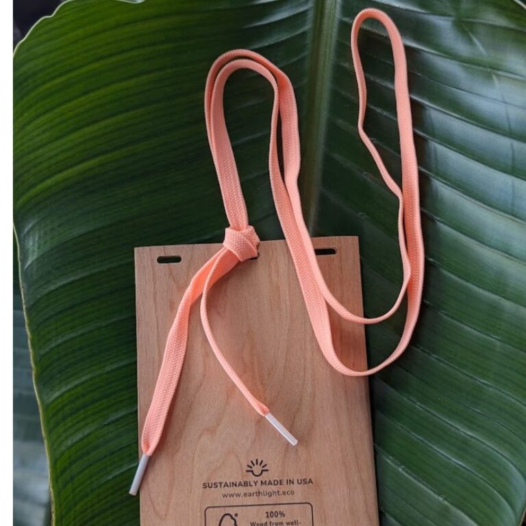 Back of plastic free wood badge holder with salmon pink salvaged drawcord lanyard made in USA