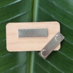 Back of sustainable US-made alderwood nametag with magnetic back