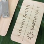 Close up of custom branded laser engraved alderwood nametag made in USA